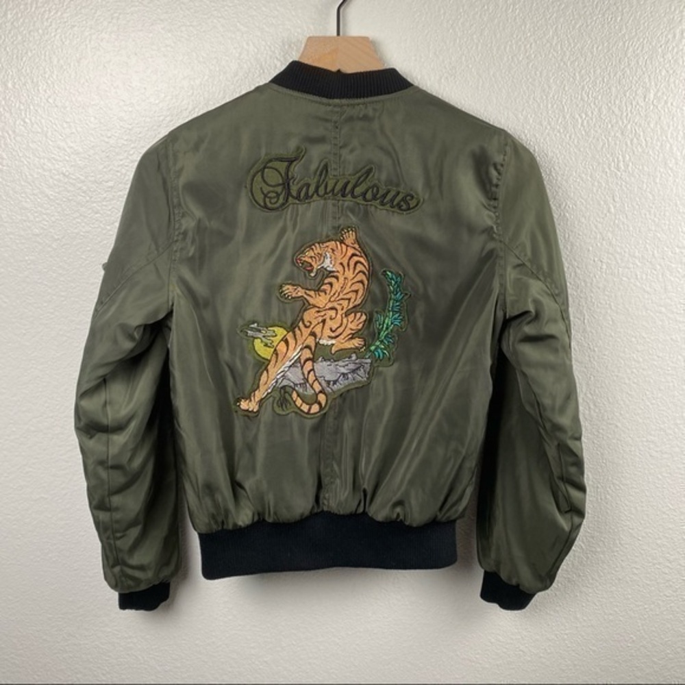 Satin Jacket with embroidered design on back.
